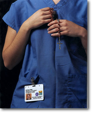 The crucifix is just a catholic thing. The candle -- I'd walk to the church on 33rd and light a candle... it's very beautiful -- light in the darkness, that sort of thing. It's ritual; you do it without thinking.
<br/><br/>
I've had my rosary since my first communion. I'd fall asleep with the rosary in my hand. It's just a comfort -- you can't crawl into bed with mom anymore.
