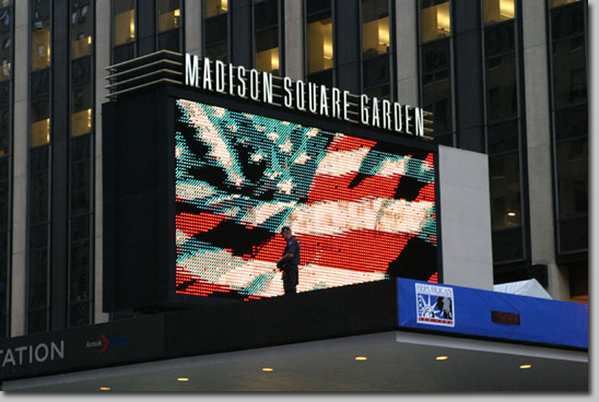The city responded with an aggressive police presence, most notoriously during an approved demonstration at Ground Zero. Under the pretext of <em>blocking a public thoroughfare,</em> several hundred demonstrators were handcuffed, photographed, and then bussed to the abandoned pier 57 building on the Hudson. They were held there for up to 48 hours, most without charges, and then released. As of this writing, a number of class action lawsuits against the city have been upheld by the courts. 